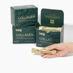 A person is holding a sachet of Key Collagen supplement with a box in the background. The sachet has a gold color with text and the box is green with 'COLLAGEN' text visible.